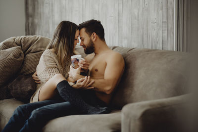 Young couple sitting on sofa