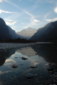 Scenic view of lake and mountains against sky