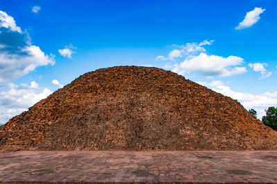 Low angle view of rock against sky