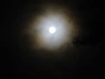 Low angle view of moon against sky at night