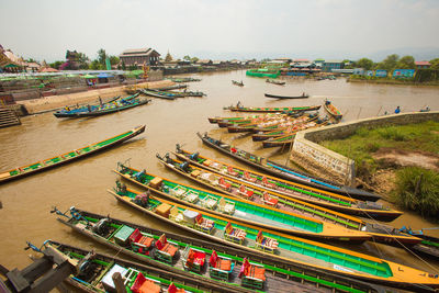 High angle view of boats moored in river against sky