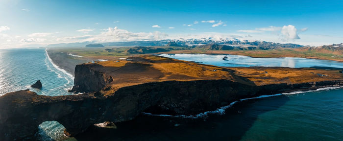 Aerial view of the iceland coastline by the black beach.