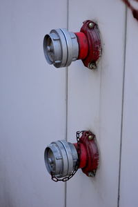 Close-up of fire hydrants on wall