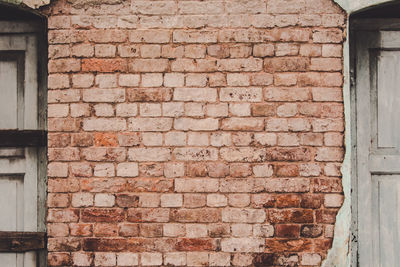 Low angle view of brick wall of building