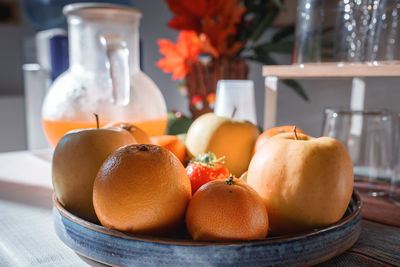 Close-up of fruits in plate on table