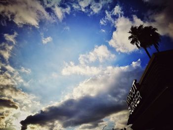 Silhouette of tree against cloudy sky