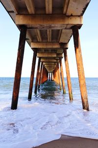 Pier over sea against sky