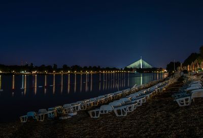 Scenic view of sea against clear sky at night