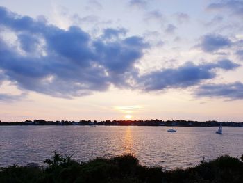 Scenic view of lake against sky during sunset