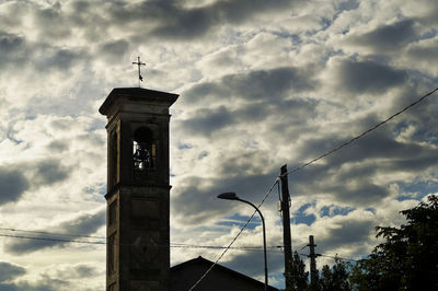 Low angle view of bell tower against sky