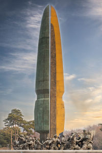 Low angle view of statue against sky