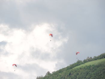 Low angle view of kite flying against sky