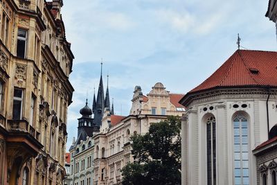 Low angle view of buildings in city against sky