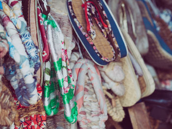 Close-up of colorful flip-flops for sale in market