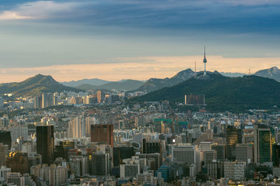 Aerial view of city buildings at sunset