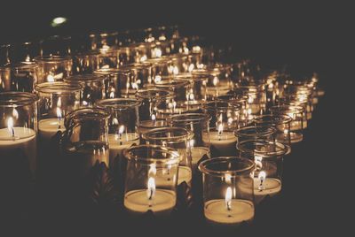 Lit tea light in room