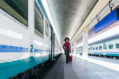 Tourist woman going for vacation trip on train