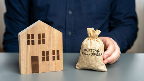 Midsection of man holding gift box