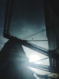 Low angle view of silhouette building against sky