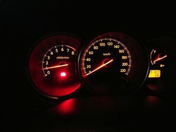 Train passing through car window at night