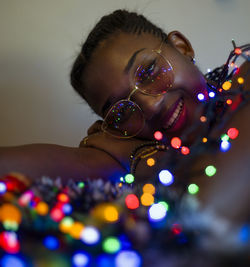 Close-up portrait of a girl surrounded by lights