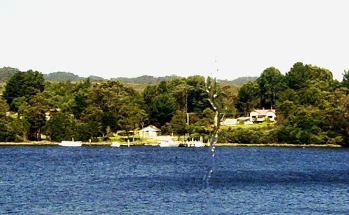 Scenic view of lake with mountains in background