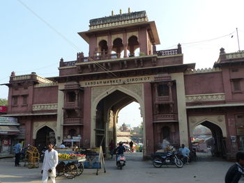 People in front of historical building