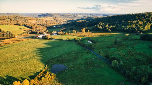 Arial shot of mountains showing the first signs of fall foliage somewhere in the catskills region