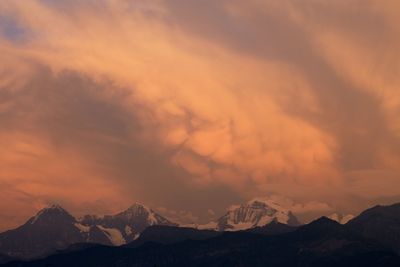 Scenic view of dramatic sky during sunset