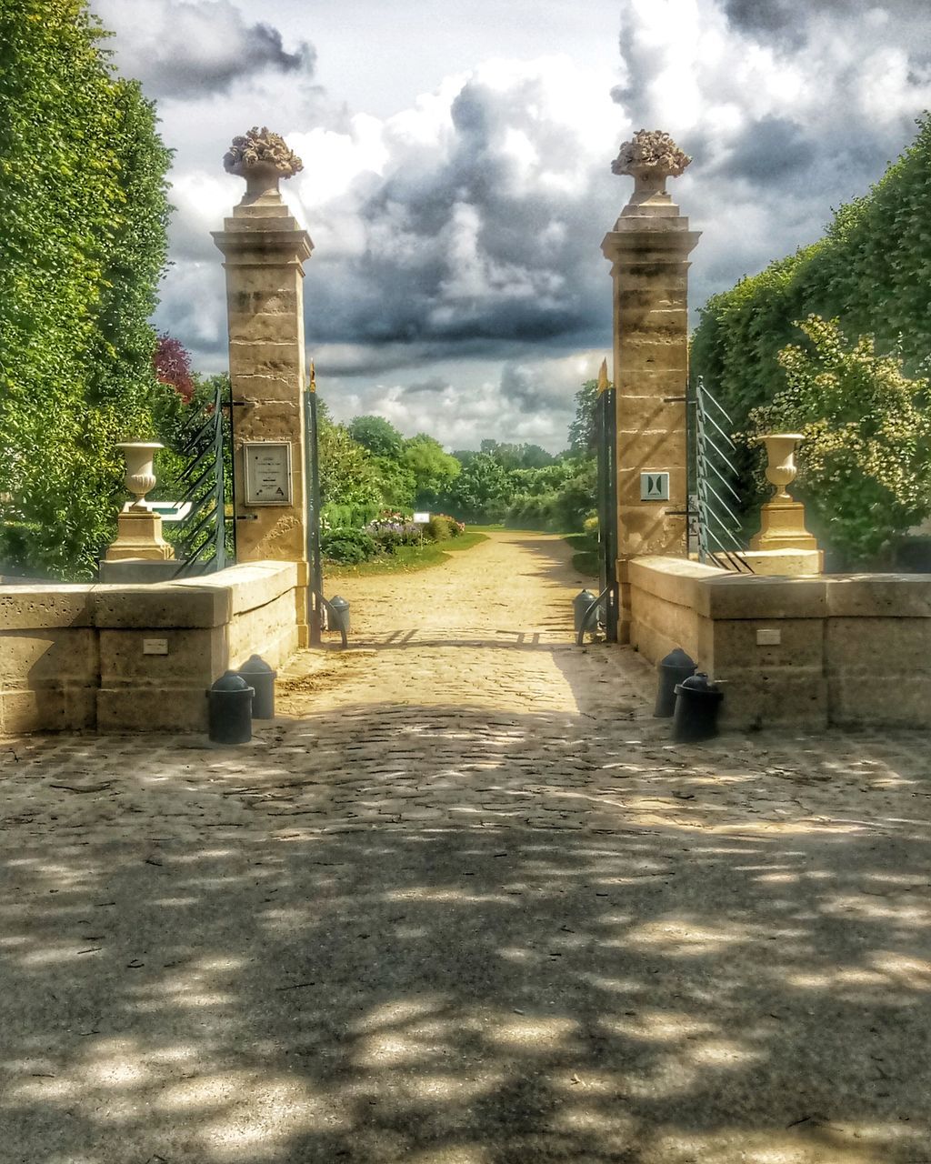 sky, cloud - sky, architecture, plant, tree, built structure, nature, building exterior, no people, building, religion, day, direction, the way forward, belief, place of worship, spirituality, lighting equipment, outdoors, the past