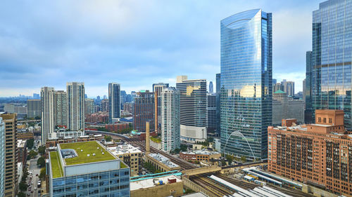 Modern buildings in city against sky