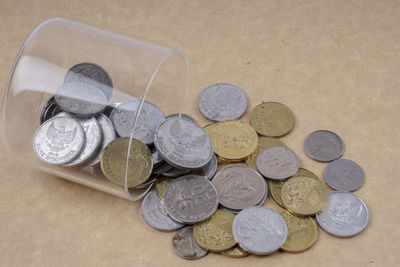 High angle view of coins on table