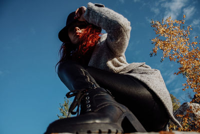 Low angle view of woman against sky