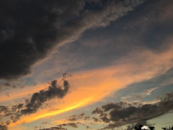 Low angle view of dramatic sky during sunset