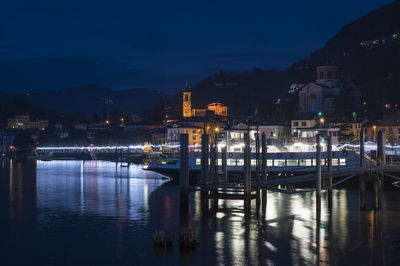 Night panorama of the lakefront of laveno illuminated by many colored christmas lights