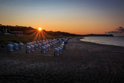 Scenic view of beach against sky during sunset