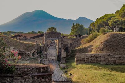 Old ruins on mountain against sky