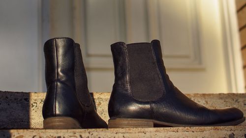 Close-up of shoes on floor at home