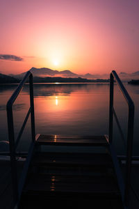 Scenic view of swimming pool against sky during sunset