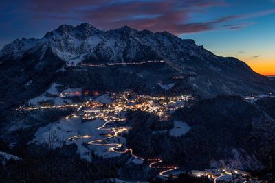 Snowy mountain village at night