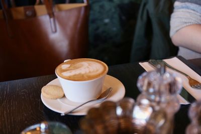 Coffee cup on table at cafe