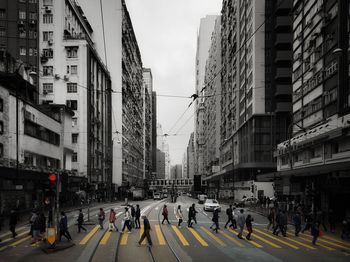 Group of people walking on city street