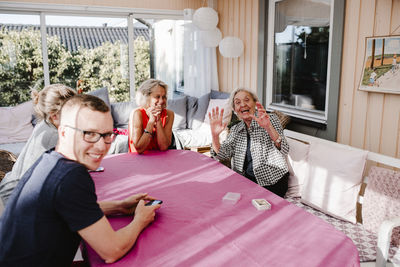 Family sitting in conservatory