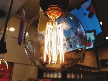 Close-up of illuminated light bulb