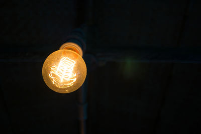 Close-up of illuminated yellow light