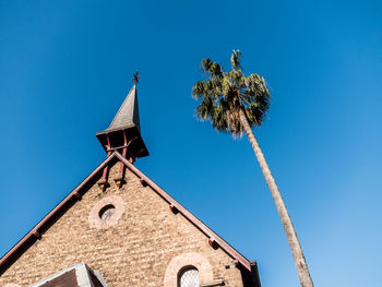 Low angle view of building against clear blue sky