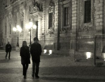 Illuminated buildings in city at night