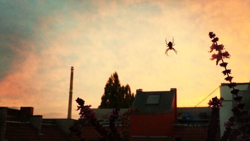 Built structure against sky at sunset