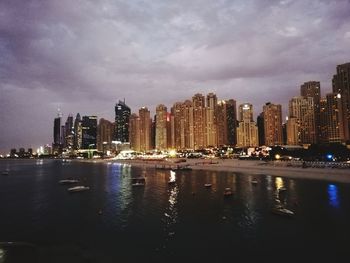 Panoramic view of city buildings at night