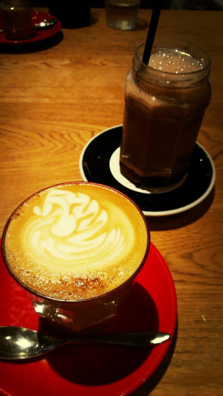 food and drink, drink, table, indoors, coffee cup, refreshment, saucer, freshness, coffee - drink, still life, frothy drink, cappuccino, coffee, froth art, cup, spoon, close-up, high angle view, beverage, latte